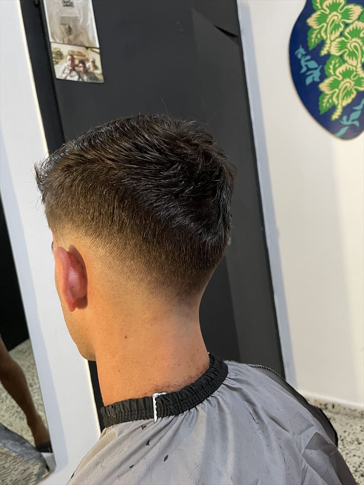 Low fade with a textured top, seen from behind
